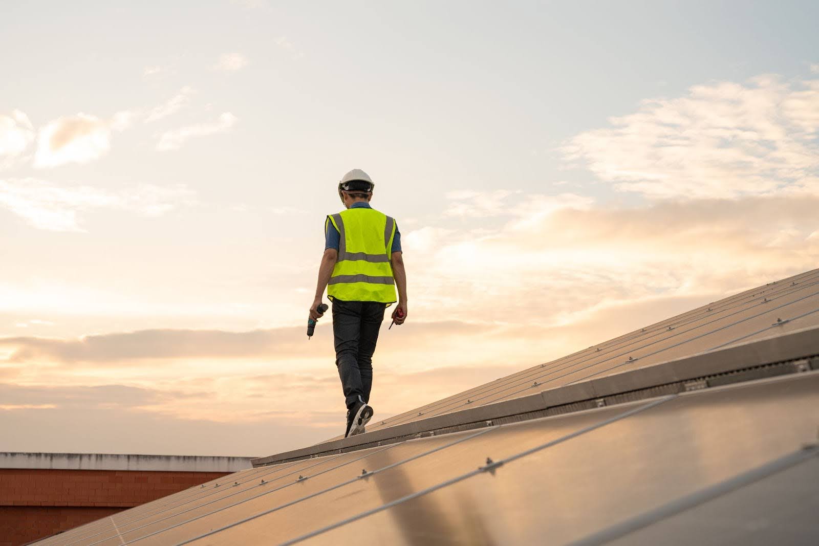A technician performing a detailed roof inspection for maintenance.