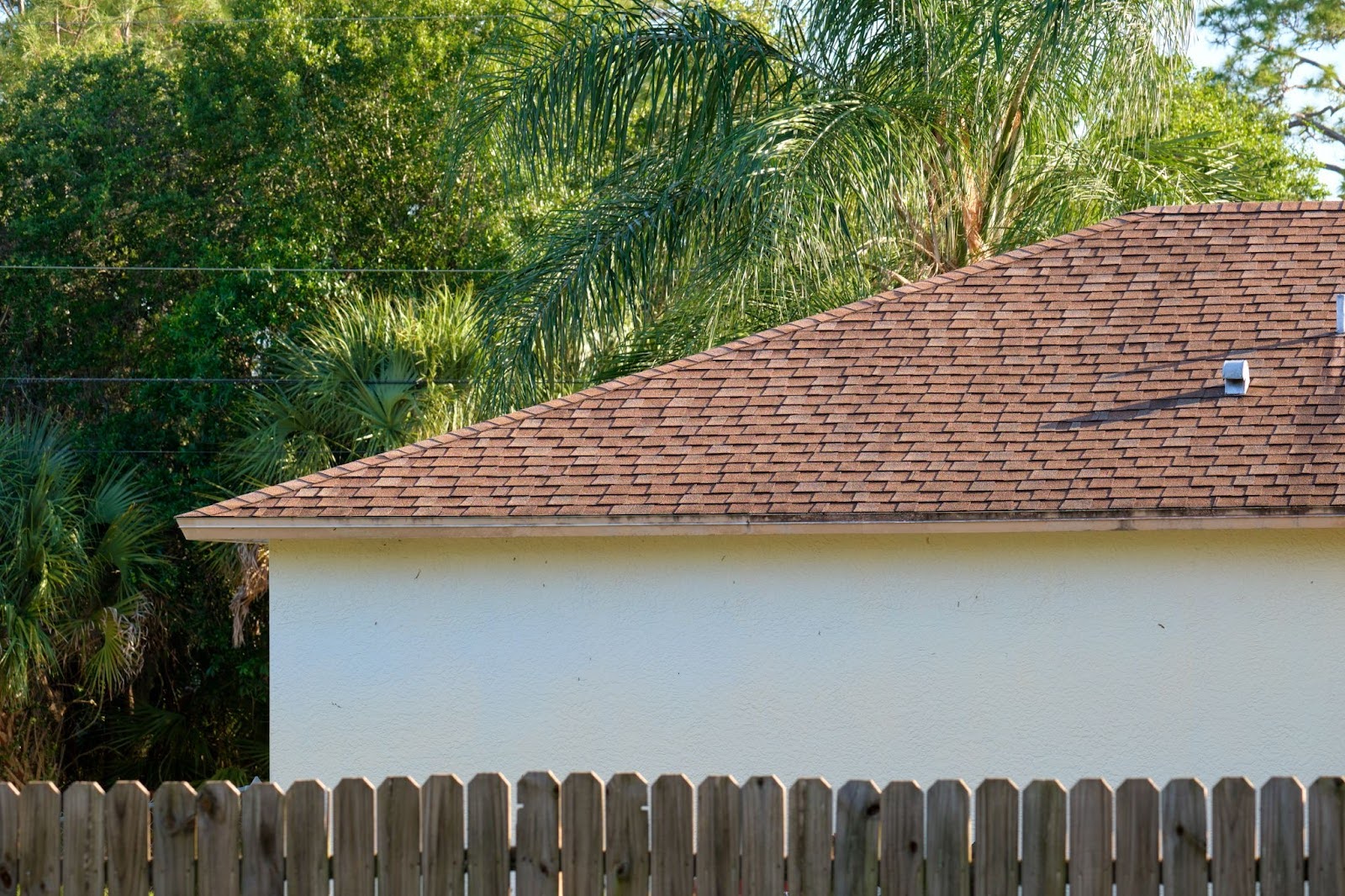 Detailed image of a home rooftop with neatly installed bitumen shingles.