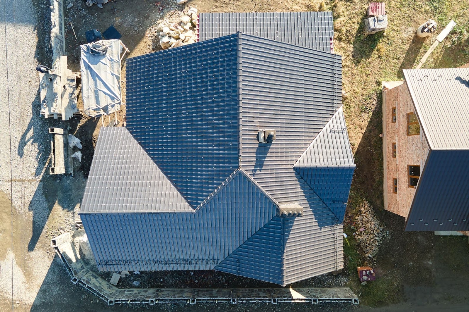 Overhead view of a home with a newly installed roof.