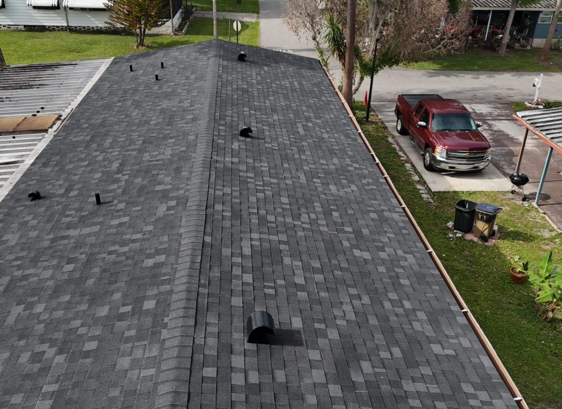 Completed architectural shingle roof with ridge and pipe ventilation by Febres Roofing